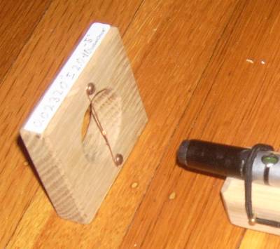 Close up view of laser and diffraction grating (wire)